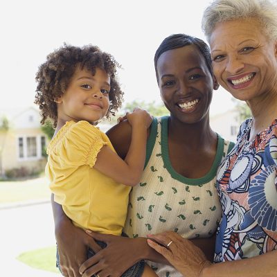 Three generations of women bonding outdoors